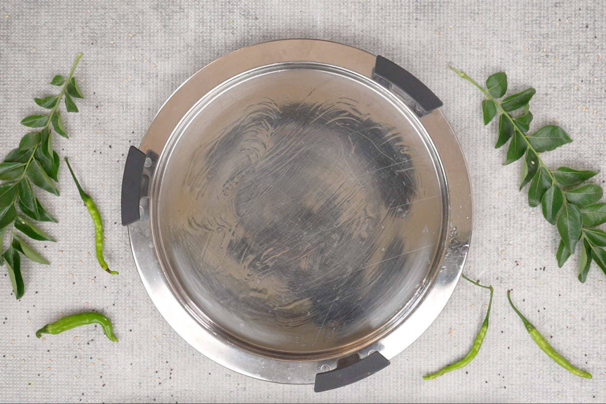 Greased dhokla steamer plate.