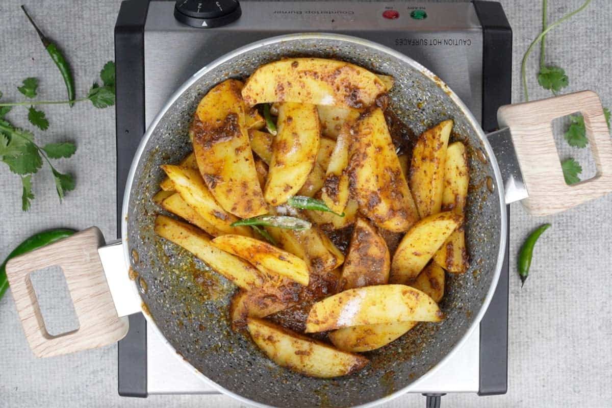 Green chilies added to the pan.