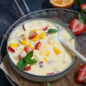 Fruit Custard is a delicious Indian dessert made with eggless custard powder and a variety of seasonal fruits. Make it using my easy recipe.