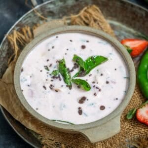 Fruit raita served in a bowl.