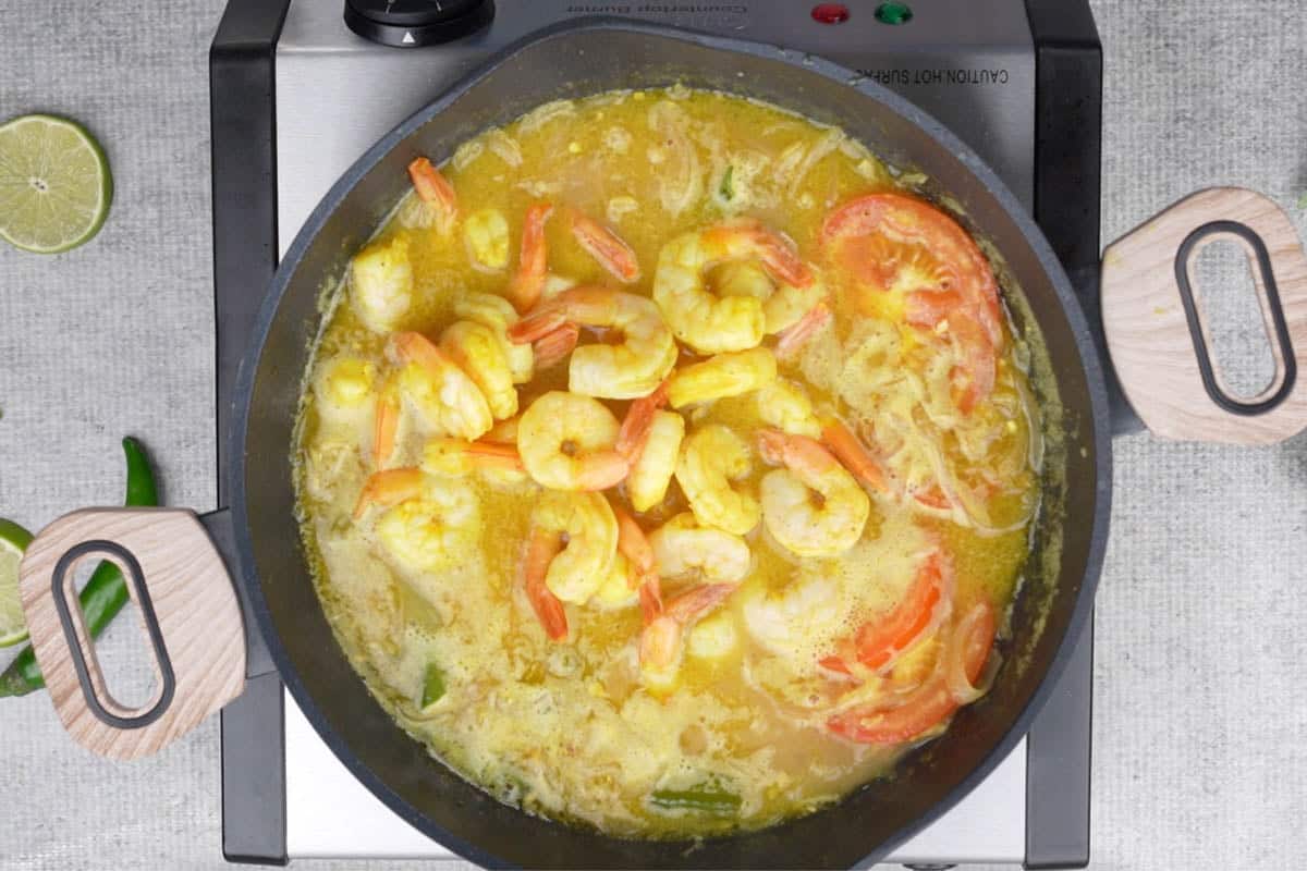 Fried shrimp added to the pan.
