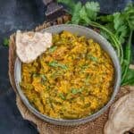 Dahi shimla mirch served in a bowl.