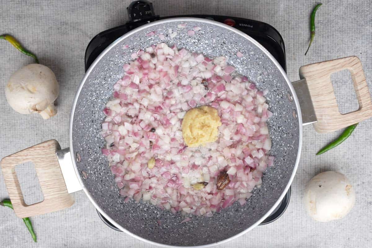 Ginger garlic paste added to the pan.