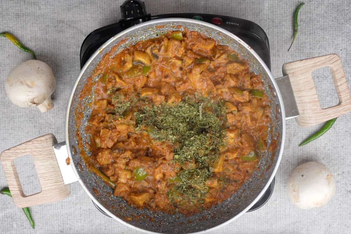 Lime juice and kasuri methi added to the pan.