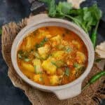 Lauki tamatar ki sabji served in a bowl.