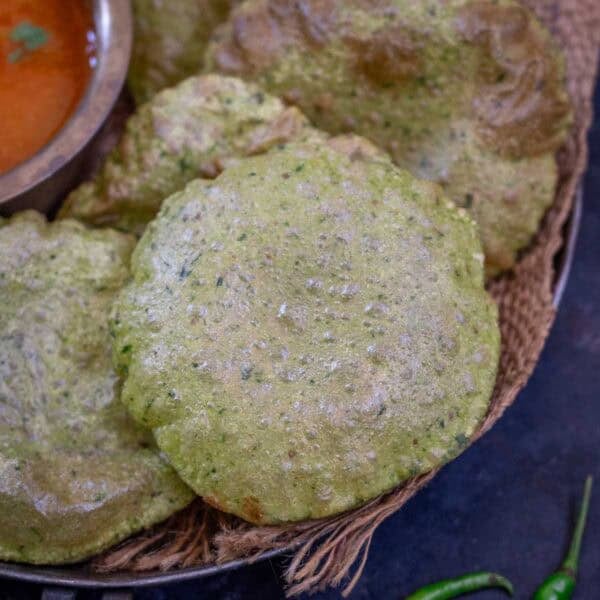 Palak puri served on a plate.