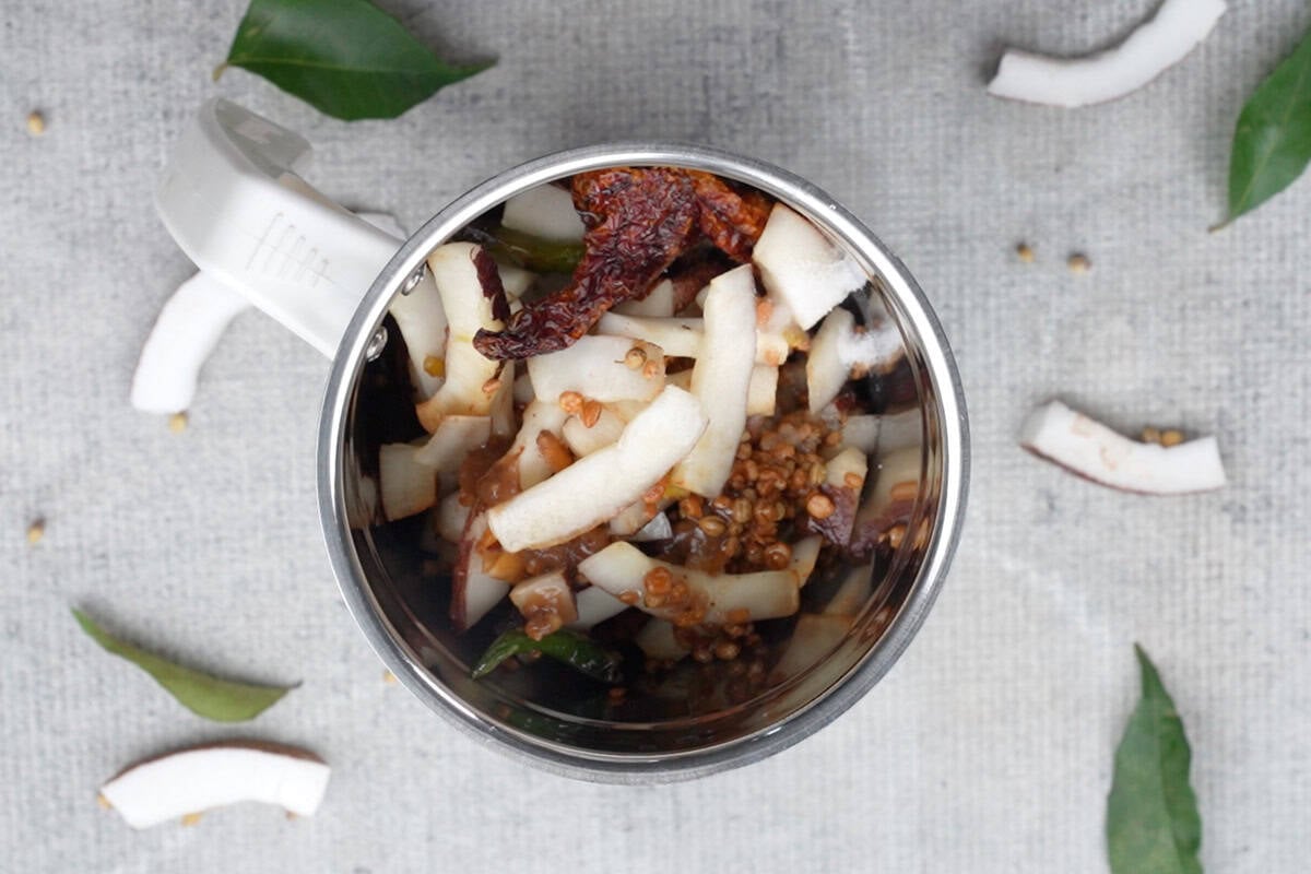 Coconut mixture, salt, tamarind paste and water added to a blender.