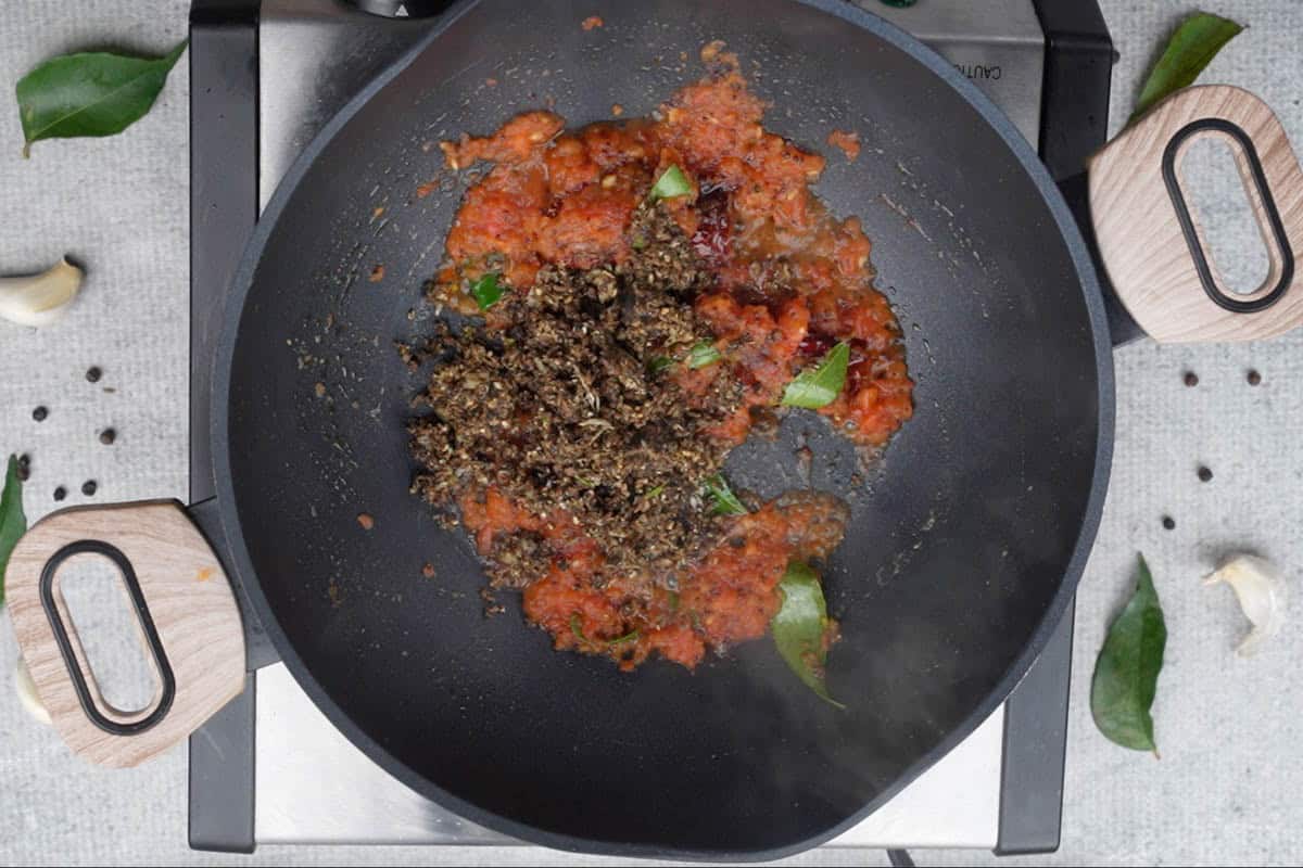 Pepper cumin paste added to the pan.