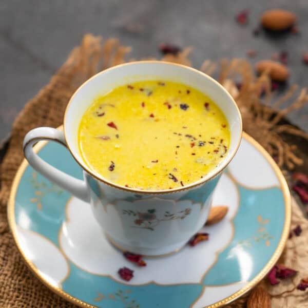 Besan doodh served in a cup.