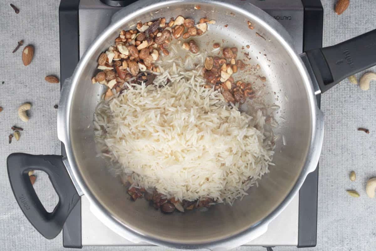 Rice added to the cooker.