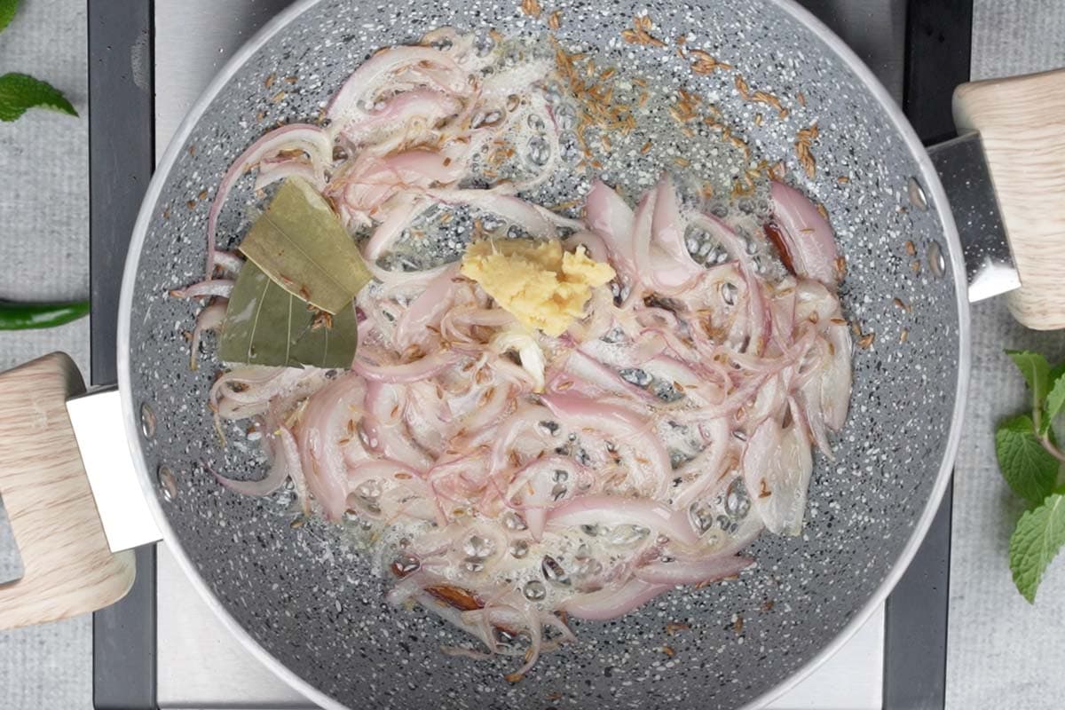 Ginger garlic paste added to the pan.