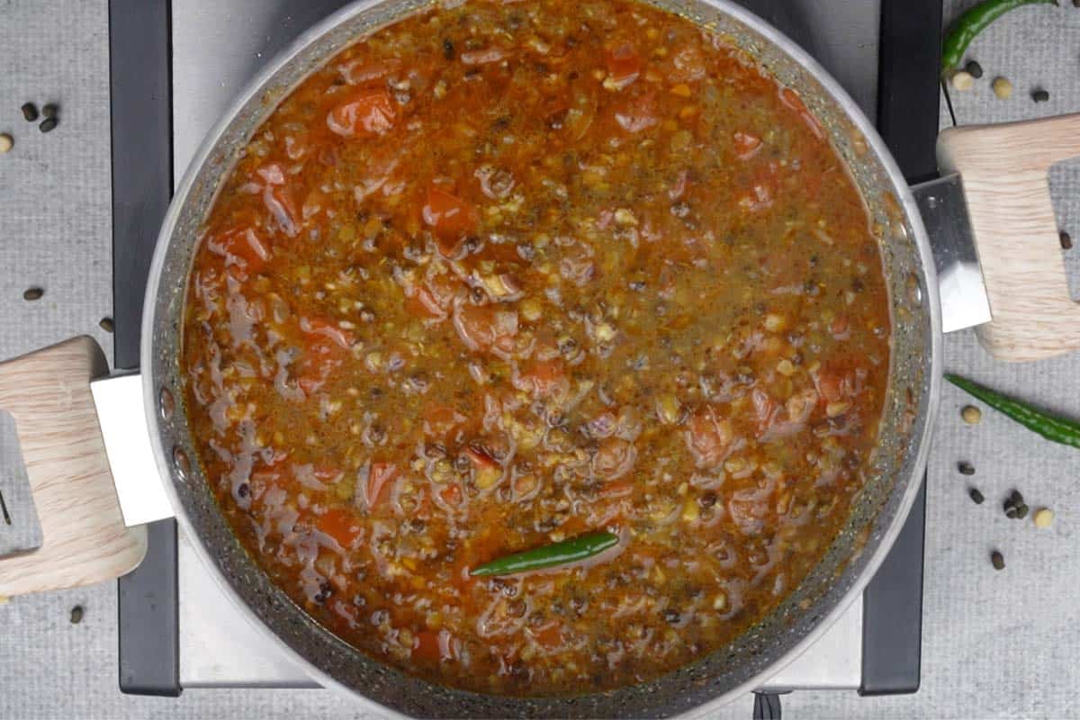 Cooked dal added to the pan.