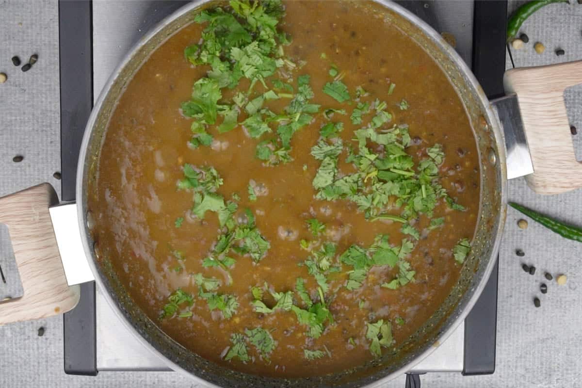 Ready dal Amritsari garnished with cilantro.