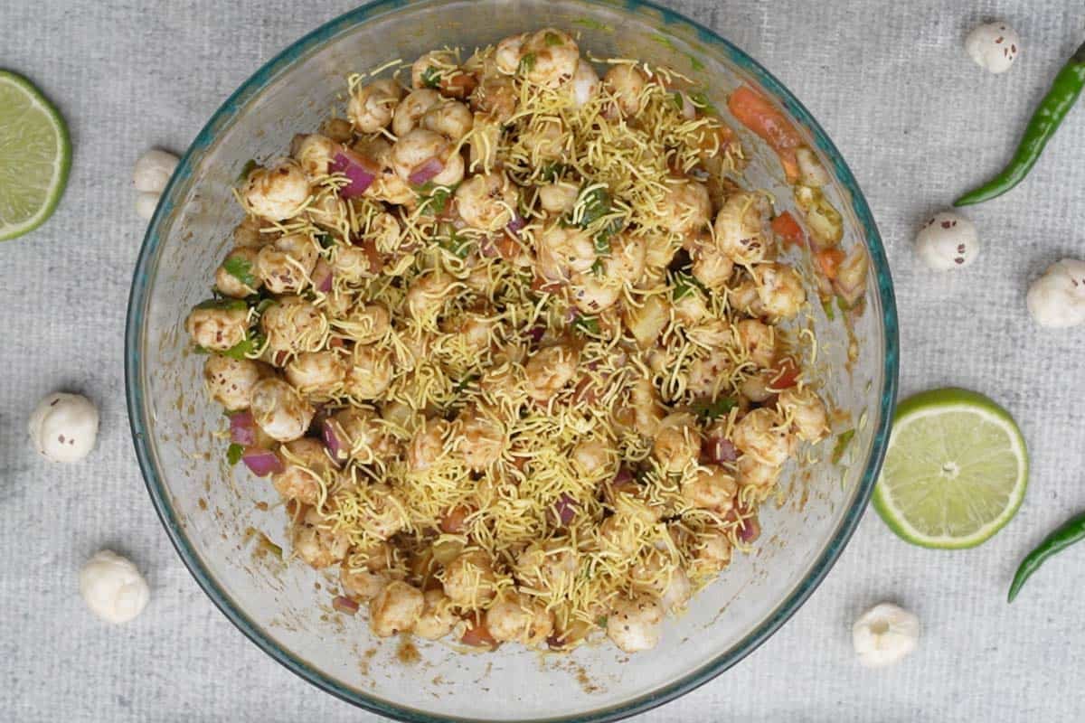 Ready makhana bhel garnished with fine sev.