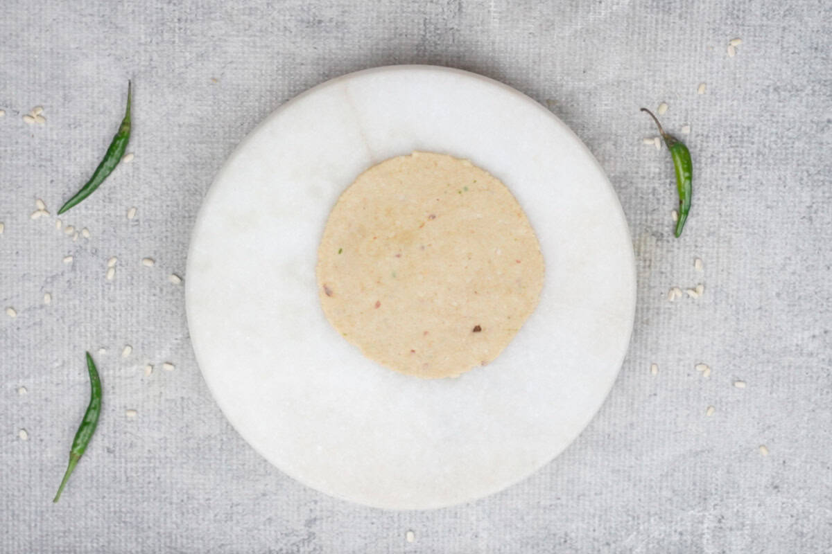 Rolled bedmi poori on the rolling surface.