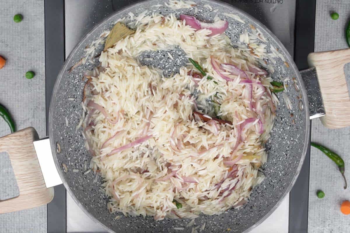 Rice added to the pan.