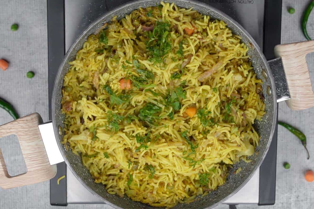 Ready chaas wala pulao fluffed witha. fork and garnished with chopped cilantro.