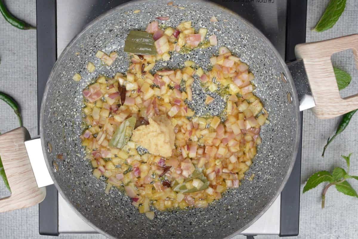 Ginger garlic paste added to the pan.