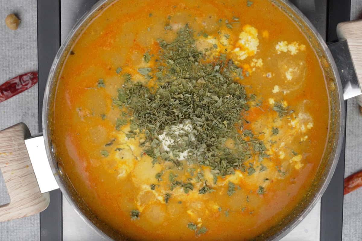 Kasuri methi, butter and heavy cream added to the pan.