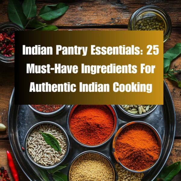 A round metal tray holds bowls of colorful Indian ingredients and seeds, surrounded by red chilies, garlic, cardamom pods, and curry leaves. Text overlay reads: Indian Pantry Essentials: 25 Must-Have Ingredients for Authentic Indian Cooking.