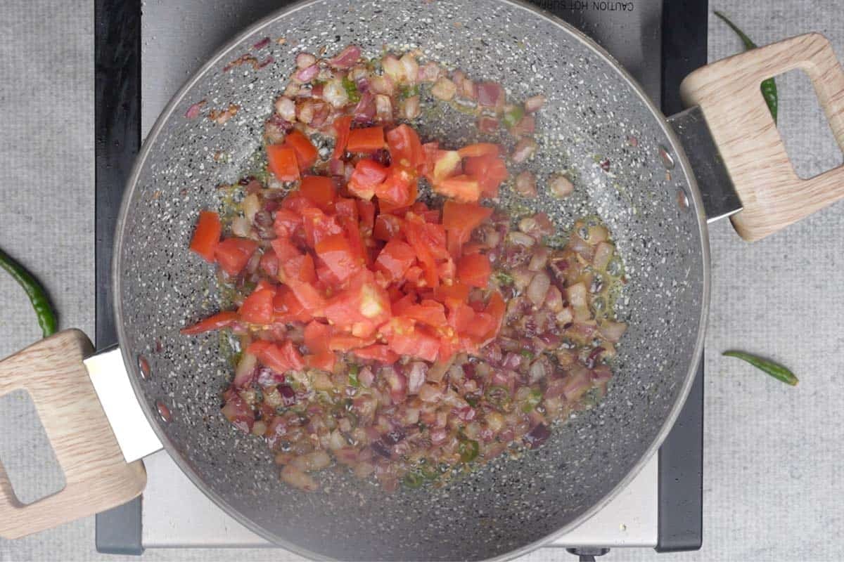 Tomatoes added to the pan.