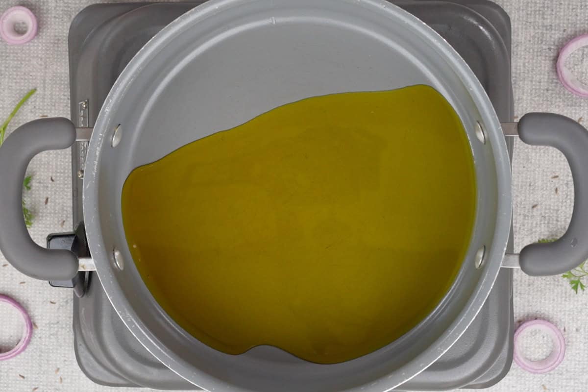 Mustard oil heating in a pan.