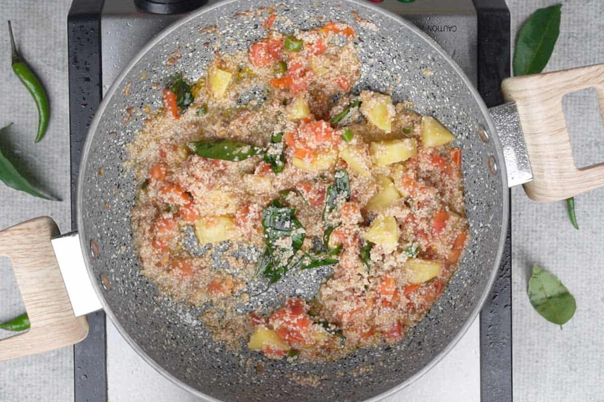 Soaked rice added to the pan.