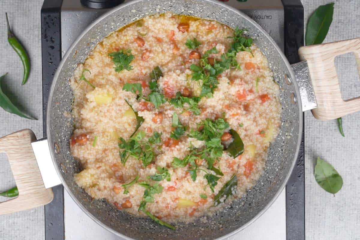 Ready samak rice khichdi garnished with chopped cilantro.